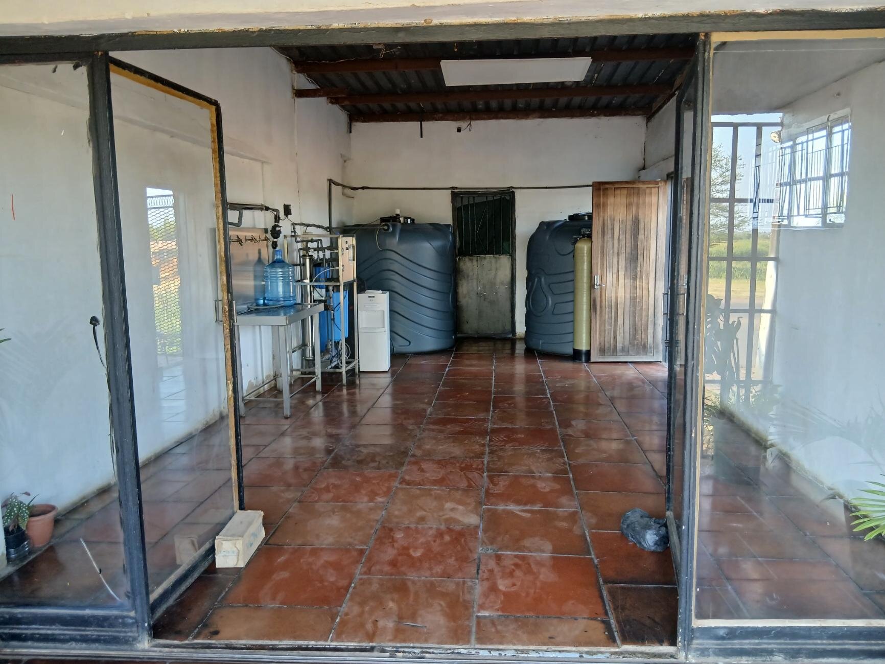 Interior of the water purification and refill facility showing tanks and equipment